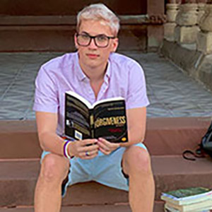 Trevor Lopinsky with a book
