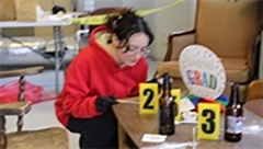 student working in Lasell forensic lab